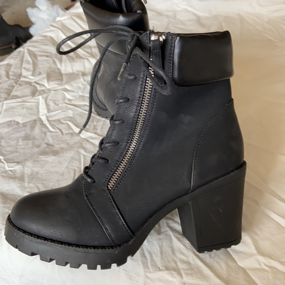 Combat heeled boots.
